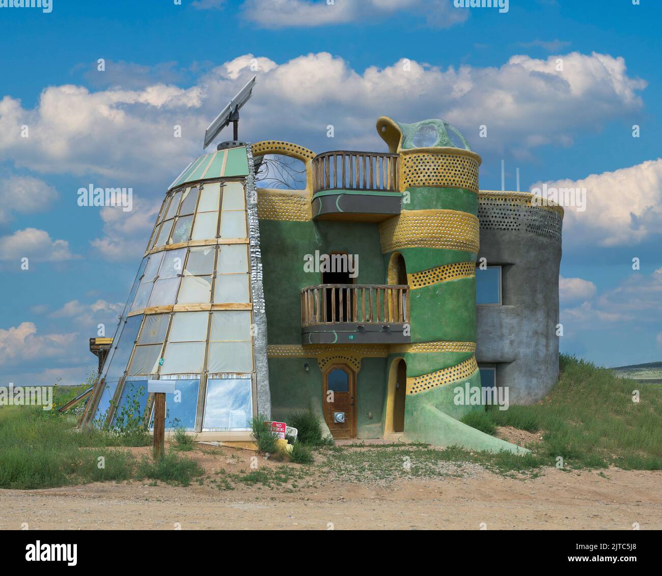 Earthship biosphere house in the desert in Tres Piedras near Taos, New Mexico Stock Photo