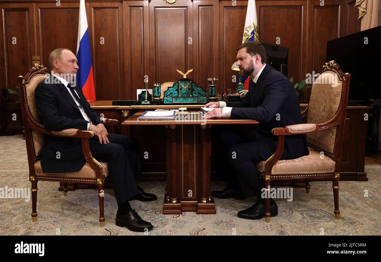 Moscow, Russia. 29th Aug, 2022. Russian President Vladimir Putin holds a face-to-face meeting with the Head of the Federal Agency for Ethnic Affairs Igor Barinov, right, at the Kremlin, August 29, 2022 in Moscow, Russia. Credit: Mikhail Klimentyev/Kremlin Pool/Alamy Live News Stock Photo