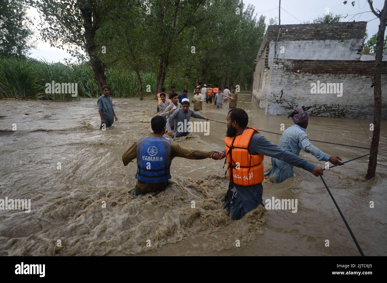 Torrential rains and storms cause flooding in Pakistan. Downpours and severe storms affected life in the Dagai Mukaram Khan region, near the city of Peshawar, Pakistan on August 26, 2022. Citizens made their way through the flooded streets with difficulty. (Photo by Hussain Ali/Pacific Press/Sipa USA) Stock Photo