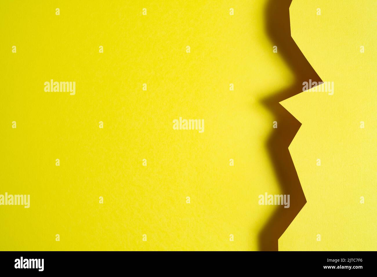 a yellow background formed with the shadow of a cut card Stock Photo