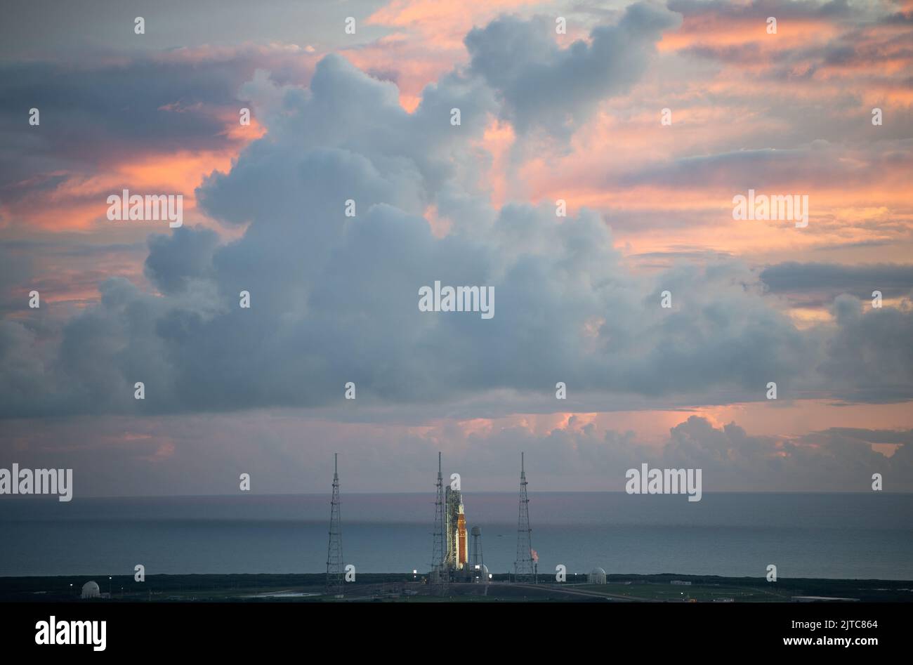 Kennedy Space Center, United States of America. 29 August, 2022. Sunrise breaks over the NASA Space Launch System rocket with the Orion spacecraft during preflight on Launch Complex 39B at the Kennedy Space Center, August 29, 2022, in Cape Canaveral, Florida. The countdown for the un-crewed flight test was halted after a problem with the fuel system caused an extended delay. Credit: Joel Kowsky/NASA/Alamy Live News Stock Photo