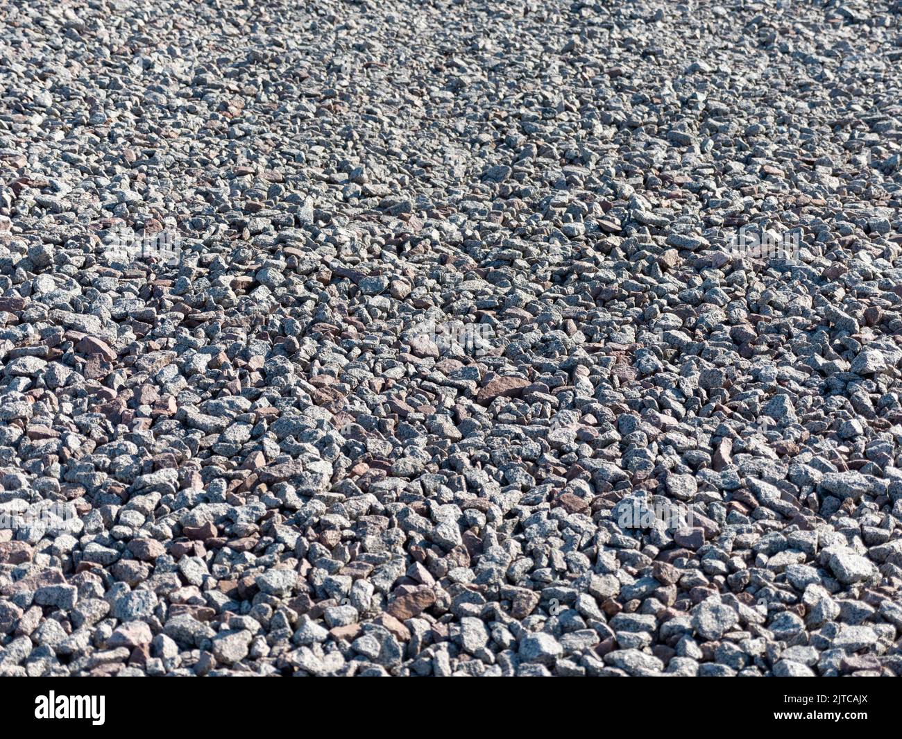 Crushed rubble and pebbles a background texture Stock Photo Alamy
