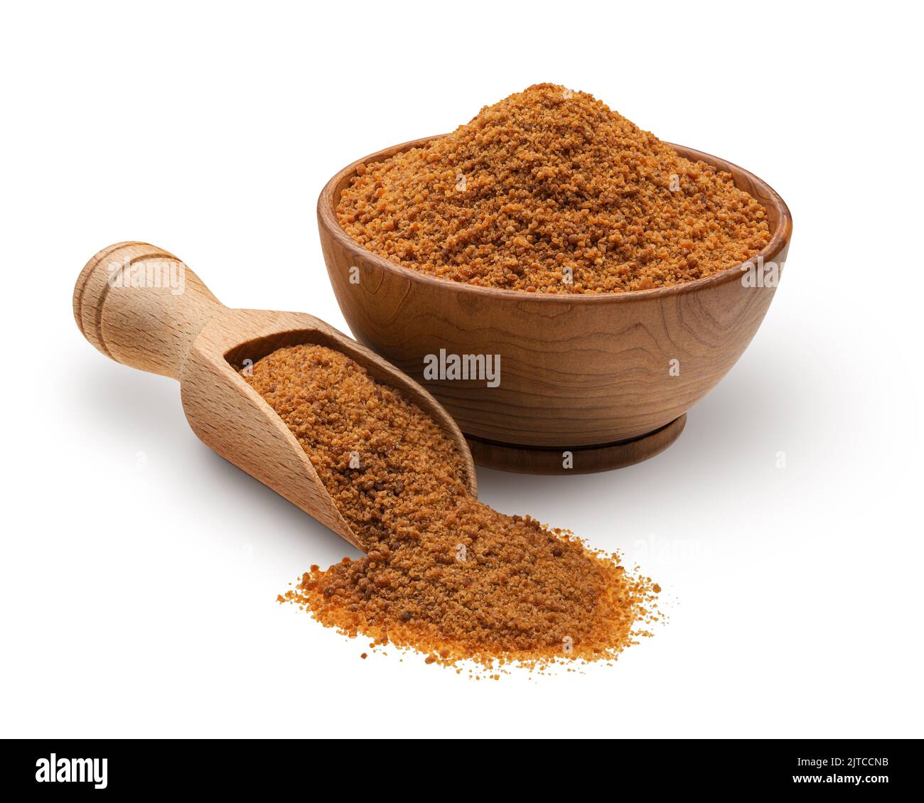 Wooden scoop and bowl full of palm sugar isolated on white background Stock Photo