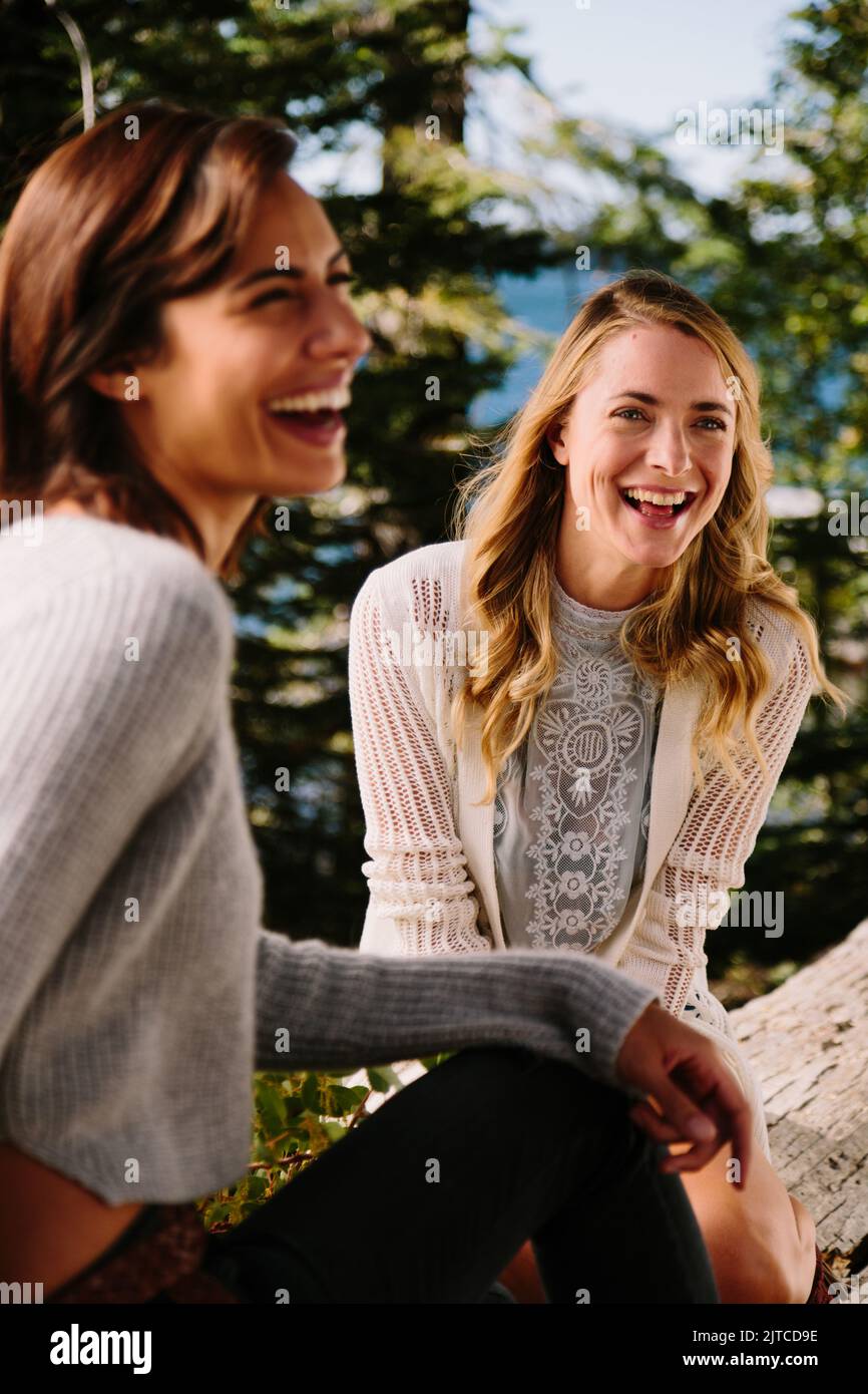 Two friends laugh while enjoying nature Stock Photo