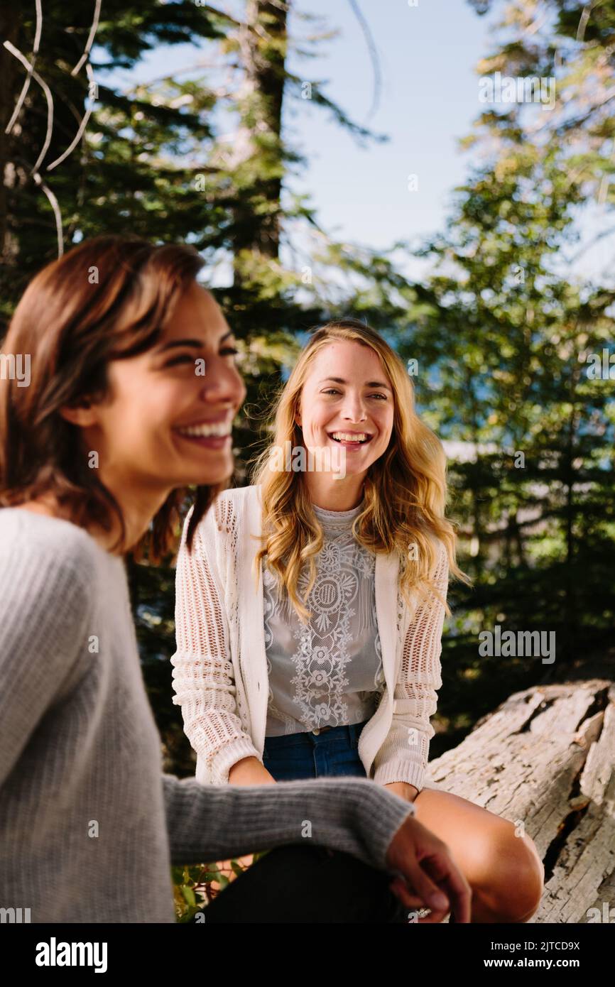 Two friends laugh while enjoying nature Stock Photo