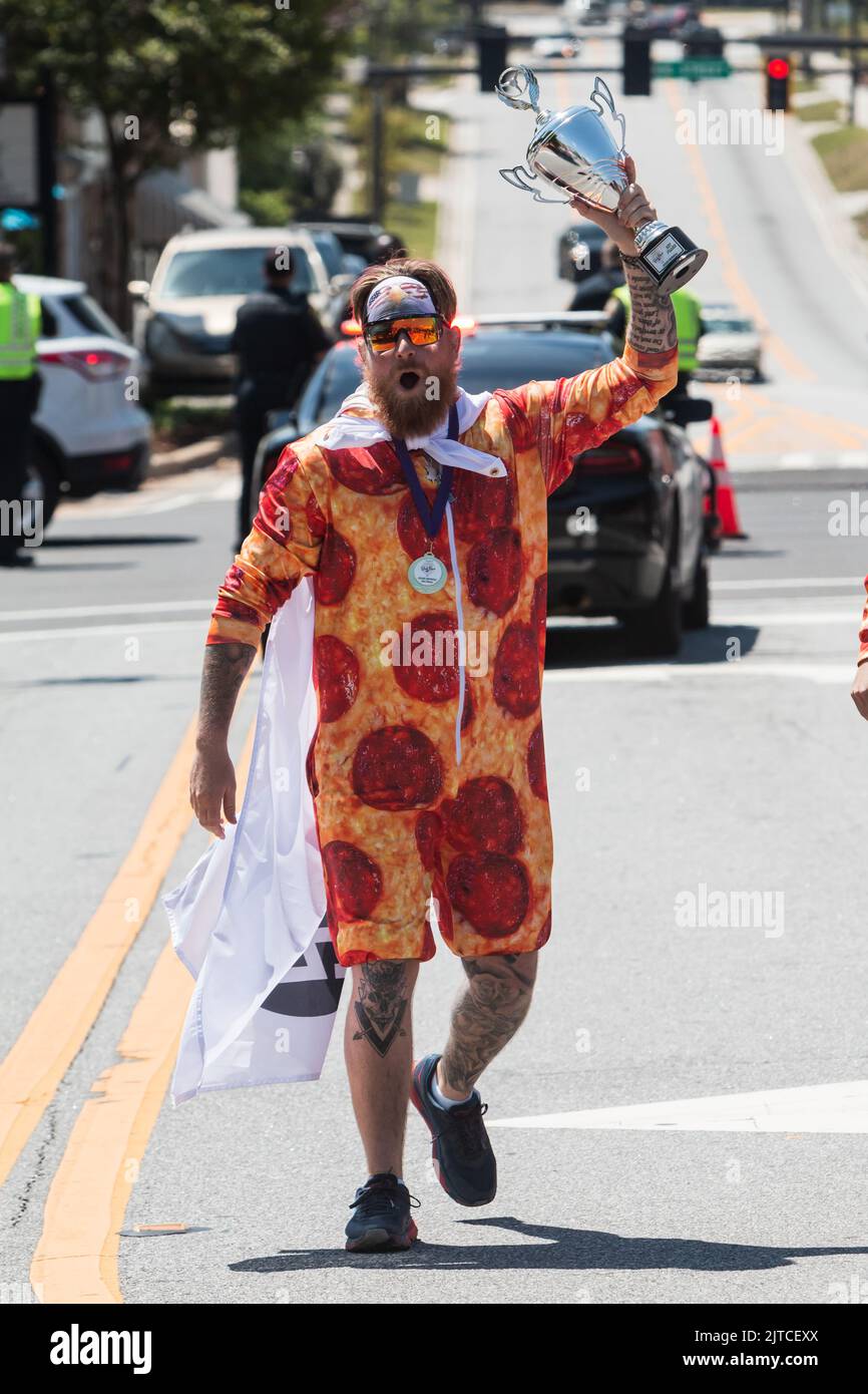LAWRENCEVILLE, GA / USA - APRIL 23, 2022: Man wearing pepperoni pizza