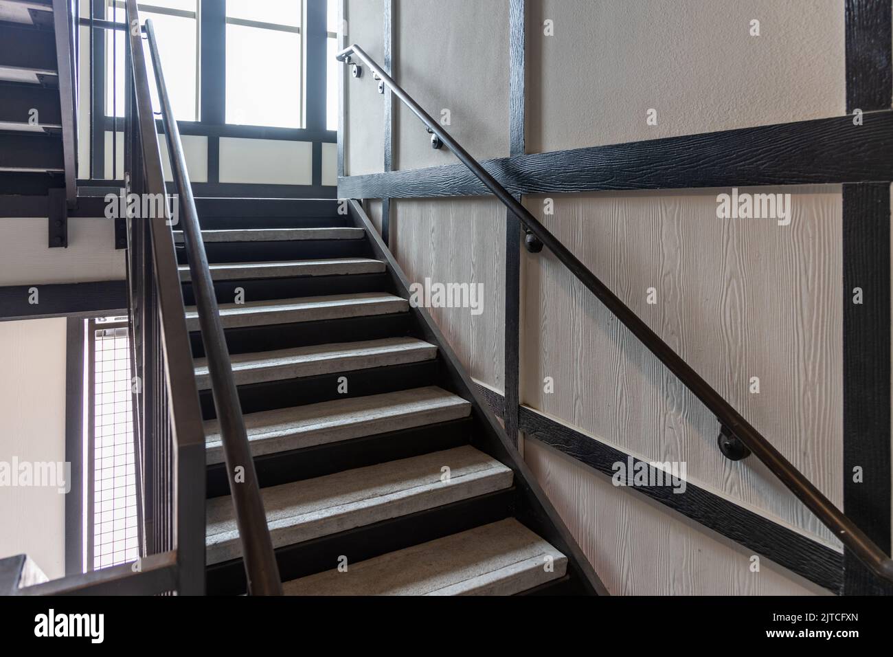 Stainless steel and wood railing. Fall Protection, modern design of handrail and staircase Stock Photo