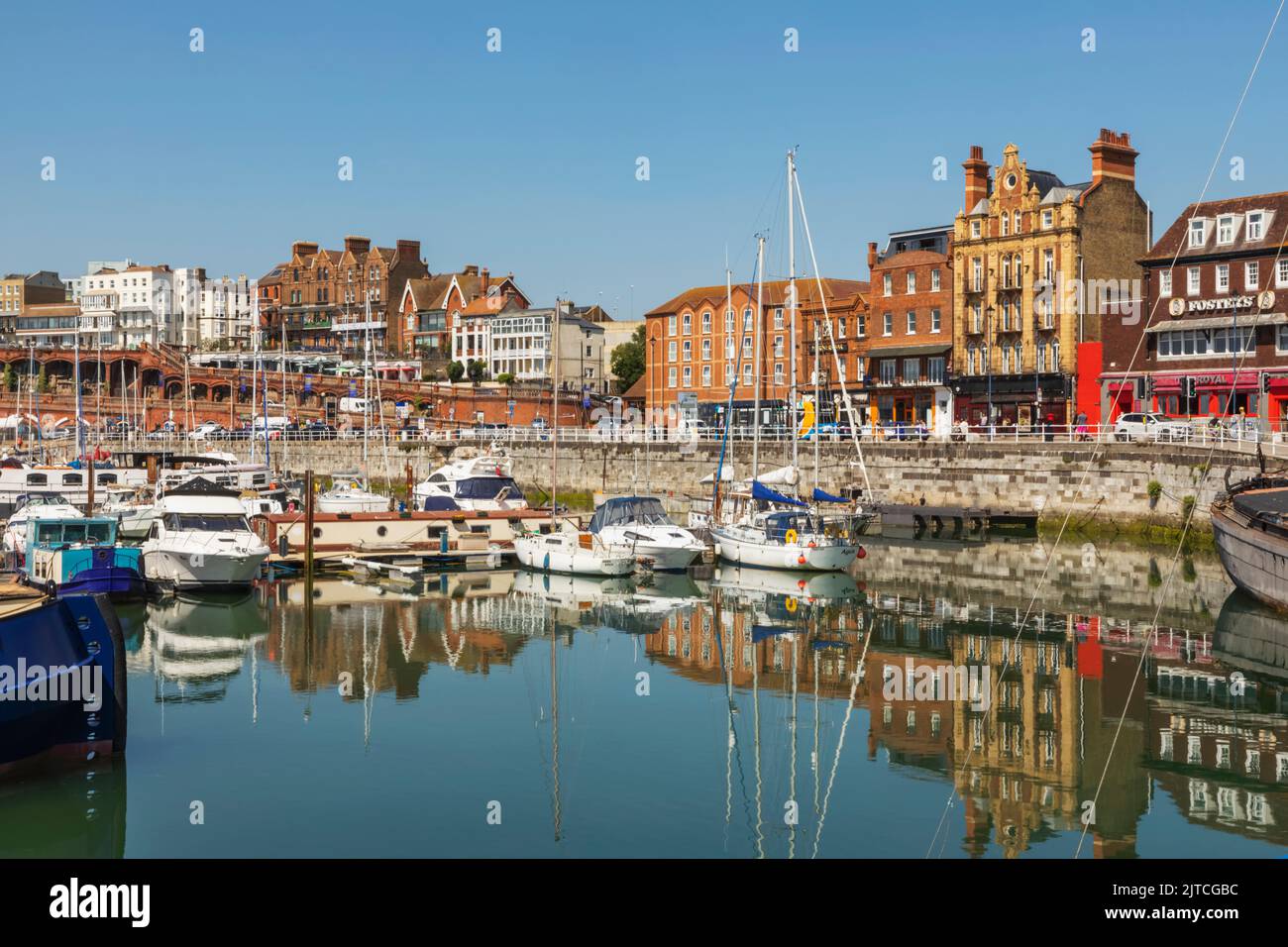 England, Kent, Ramsgate, Ramsgate Yacht Marina and Town Skyline, Reflection of Yachts in the Water Stock Photo