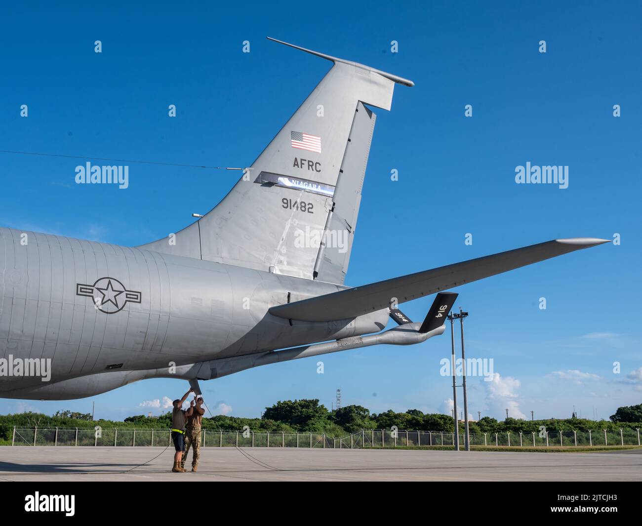 U.S. Air Force Capt. Dave Carr, a pilot, and Senior Airman Nicholas Hawkins, a crew chief, both with the 914th Air Refueling Wing, New York, visually inspect the exterior of a KC-135 Stratotanker August 29, 2022 on a flightline in the Indo-Pacific Area of Responsibility. The Stratotanker was on a mission to refuel a U.S. Navy P-8 Poseidon, with the Naval Air Station Jacksonville, Florida. The Poseidon is multi-mission maritime patrol aircraft, specializing in anti-submarine warfare; anti-surface warfare; intelligence, surveillance and reconnaissance and search and rescue. (U.S. Air Force photo Stock Photo