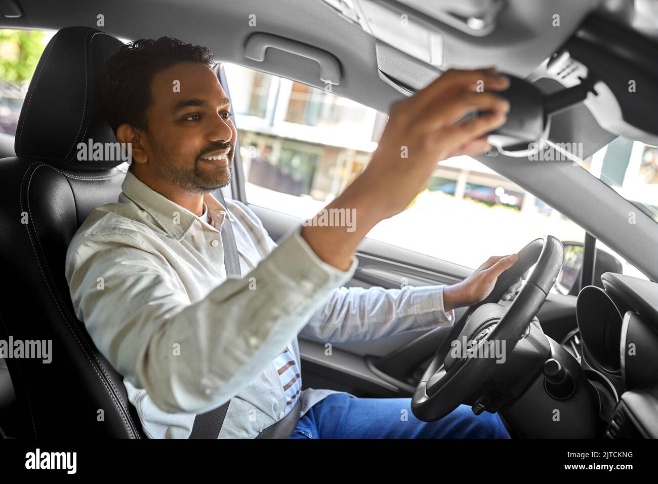 Man car driver adjusting hi-res stock photography and images - Alamy