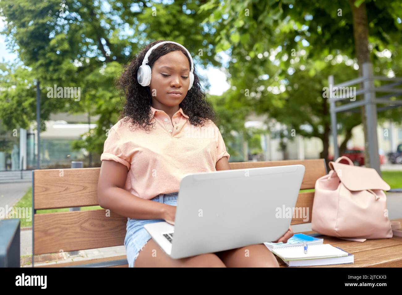 african student girl in headphones with laptop Stock Photo - Alamy