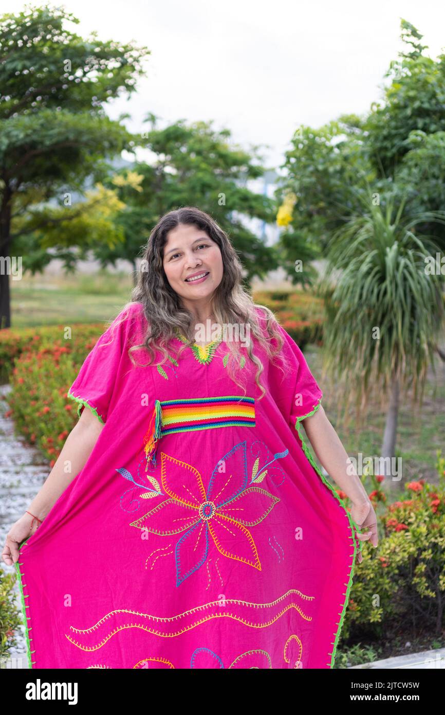 Colombian indigenous woman wearing traditional dress in a park Stock ...