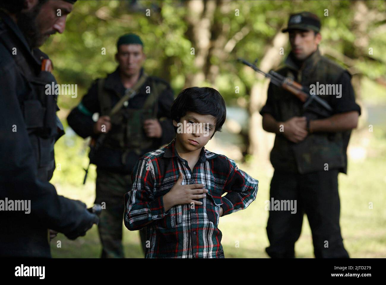 CHILD WITH SOLDIERS, 12, 2007 Stock Photo
