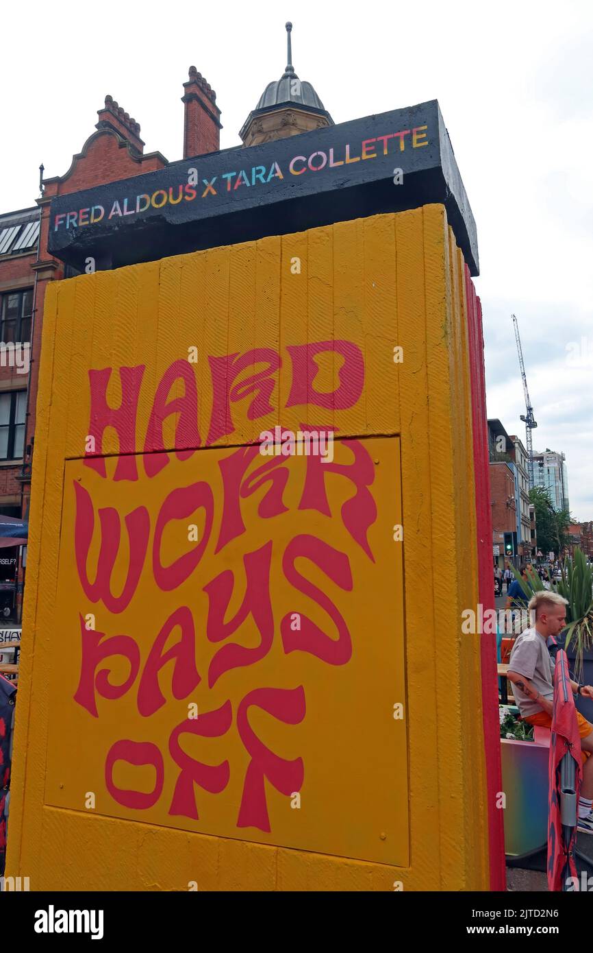 Good advice, Hard Work Pays Off , Fred Aldous, X Tara Collette, in Stephenson Square, Northern Quarter, Manchester, England, UK, M1 1JF Stock Photo