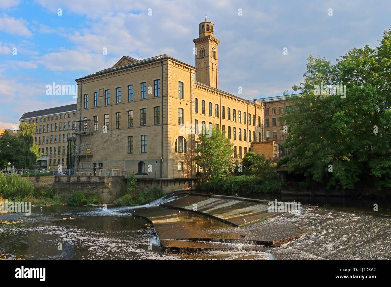 Listed buildings, mills & river Aire in Saltaire world heritage village site, Shipley, Bradford, West Yorkshire, England, UK, BD18 3LA Stock Photo