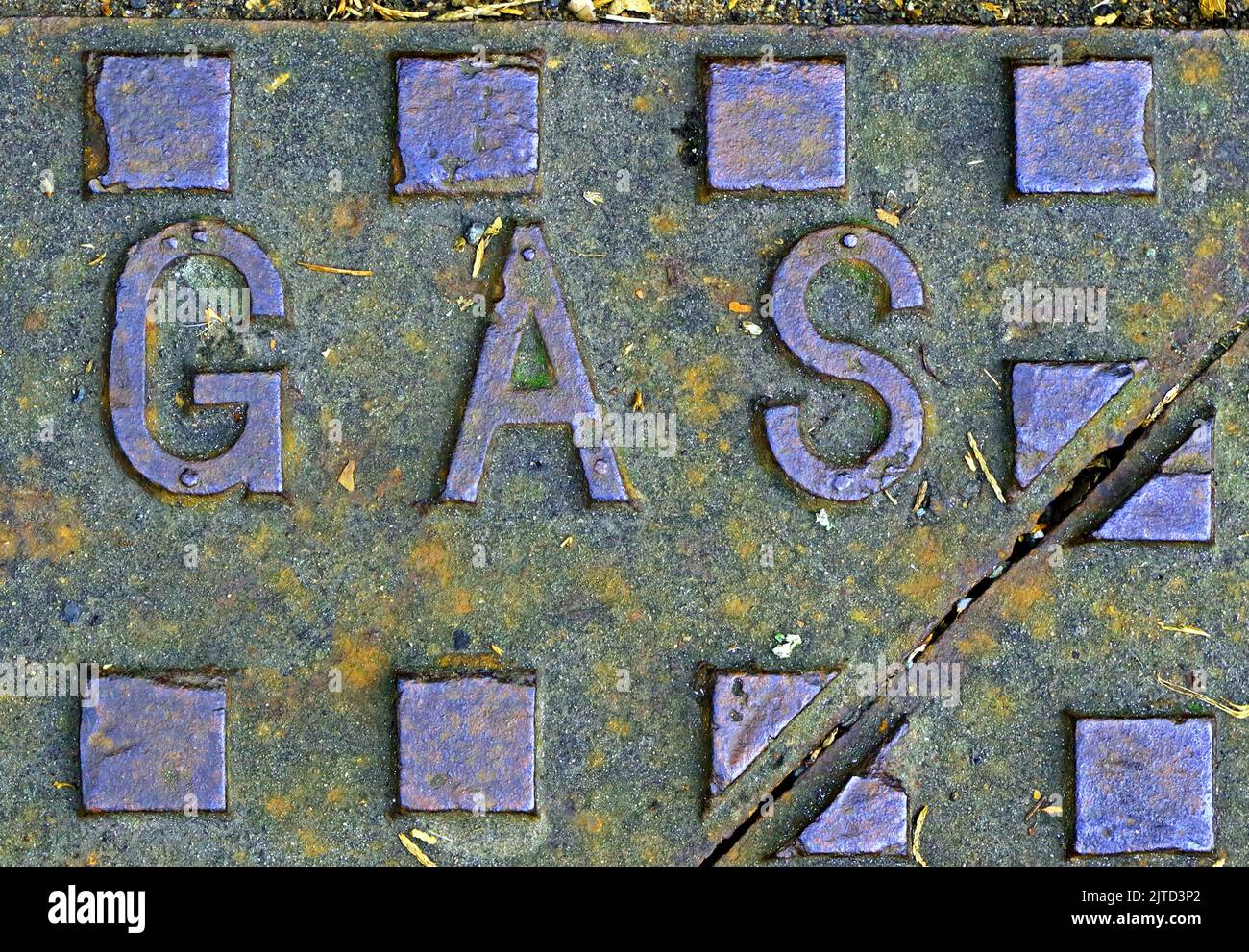 Gas supply ironwork Grid, cast iron embossed with the word gas Stock Photo
