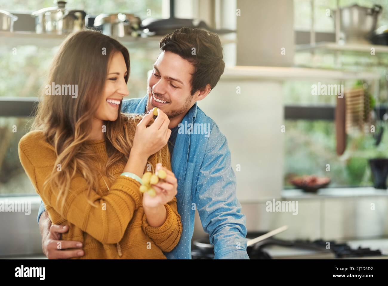 Woman feeding boyfriend hi-res stock photography and images - Page 2 - Alamy