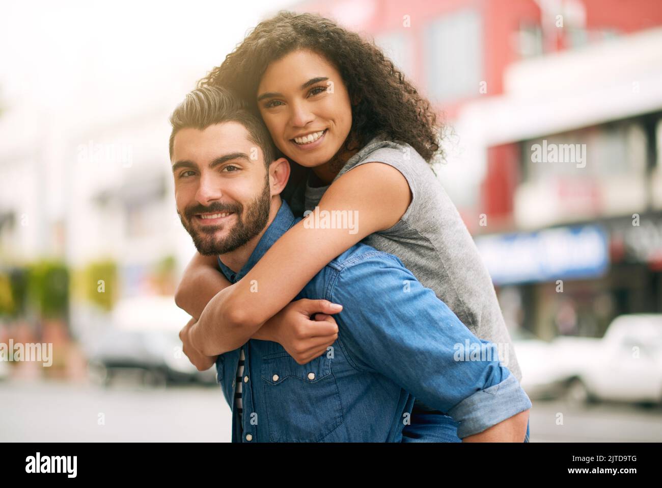 Hell do anything to make her happy. a playful couple out in the city together. Stock Photo