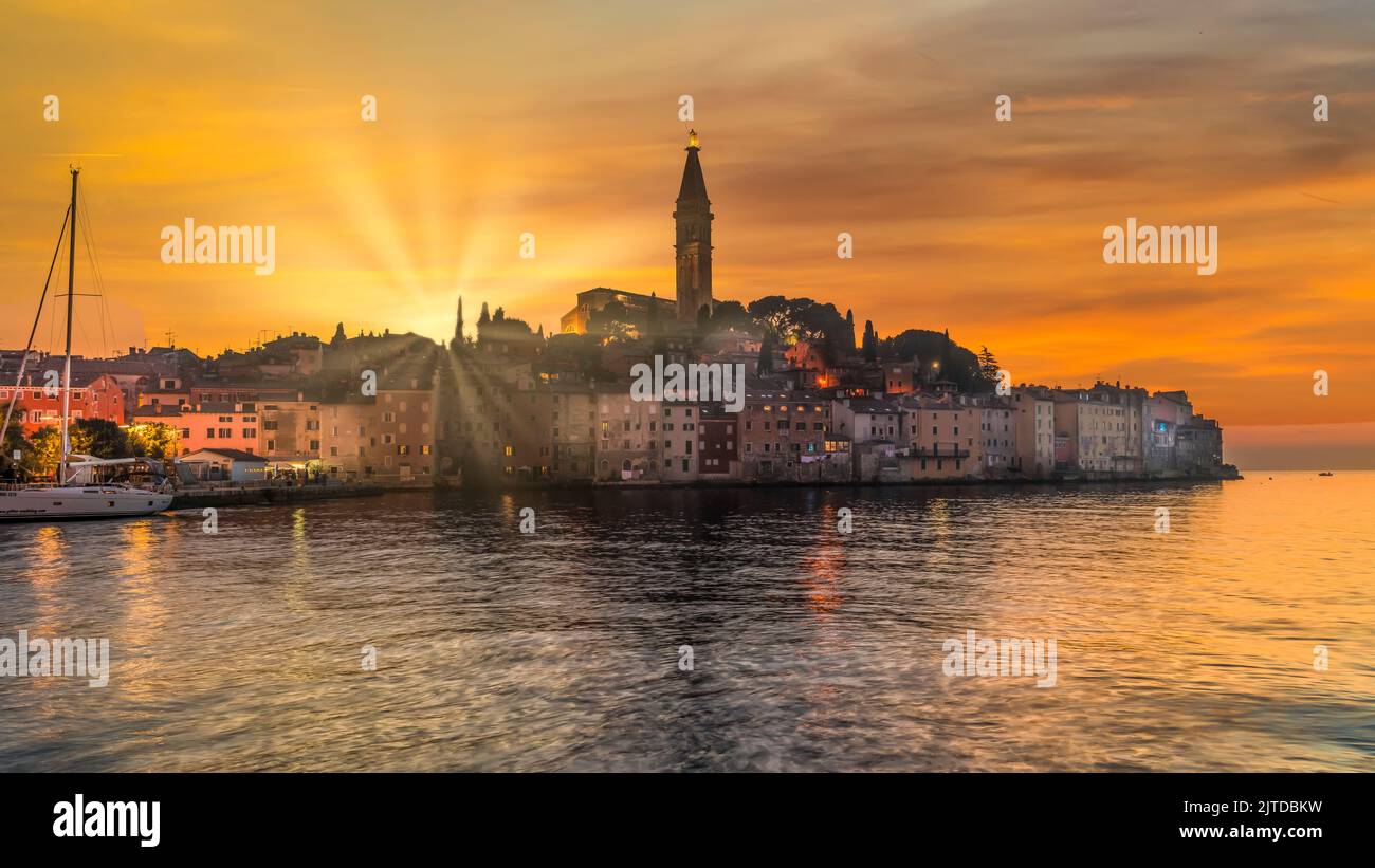 The village skyline and the Adriatic Sea at sunset at Rovinj, Croatia, Istria. Stock Photo