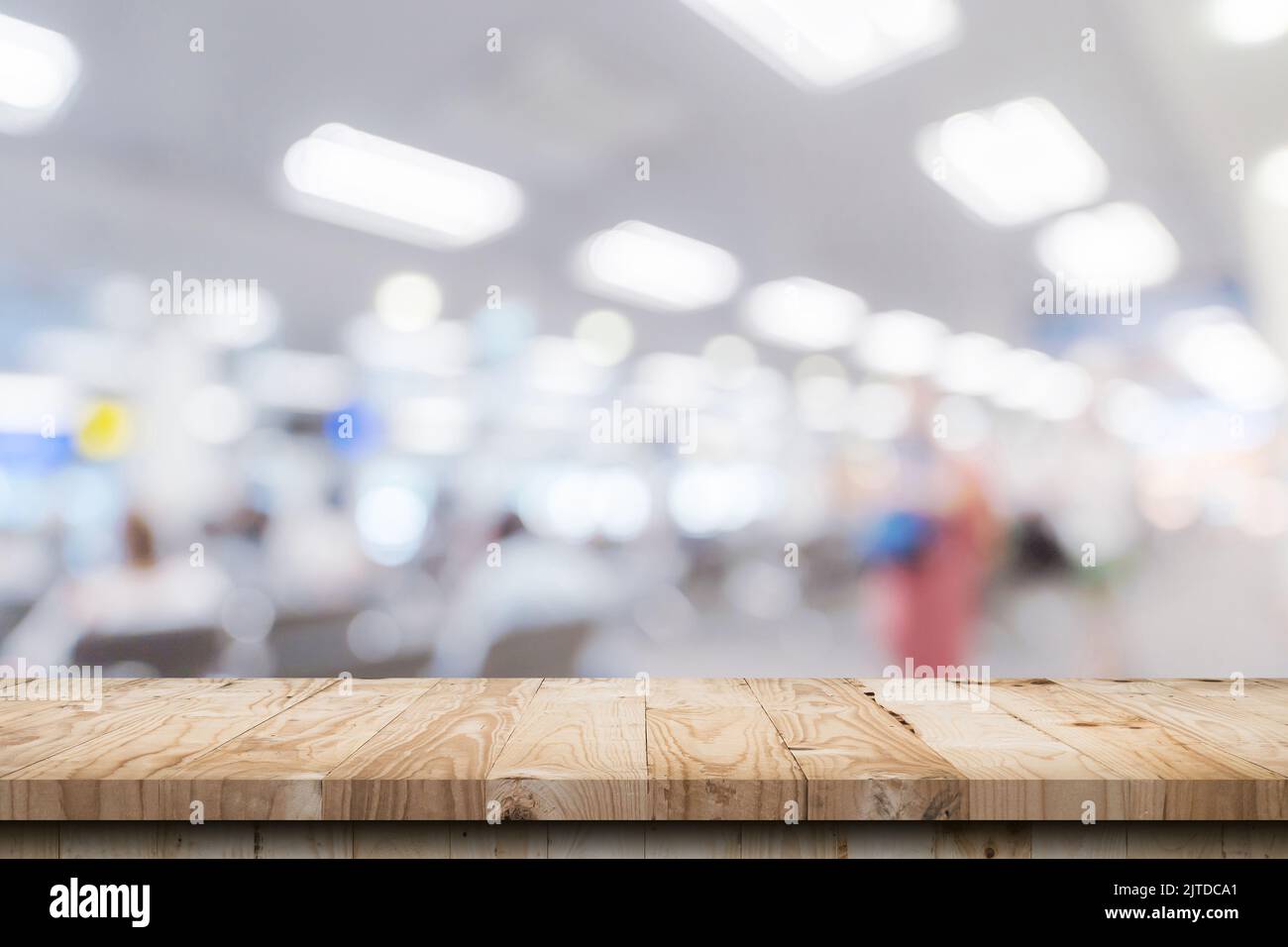 Empty wooden table anb Abstract blur airport interior for backgounrd Stock Photo