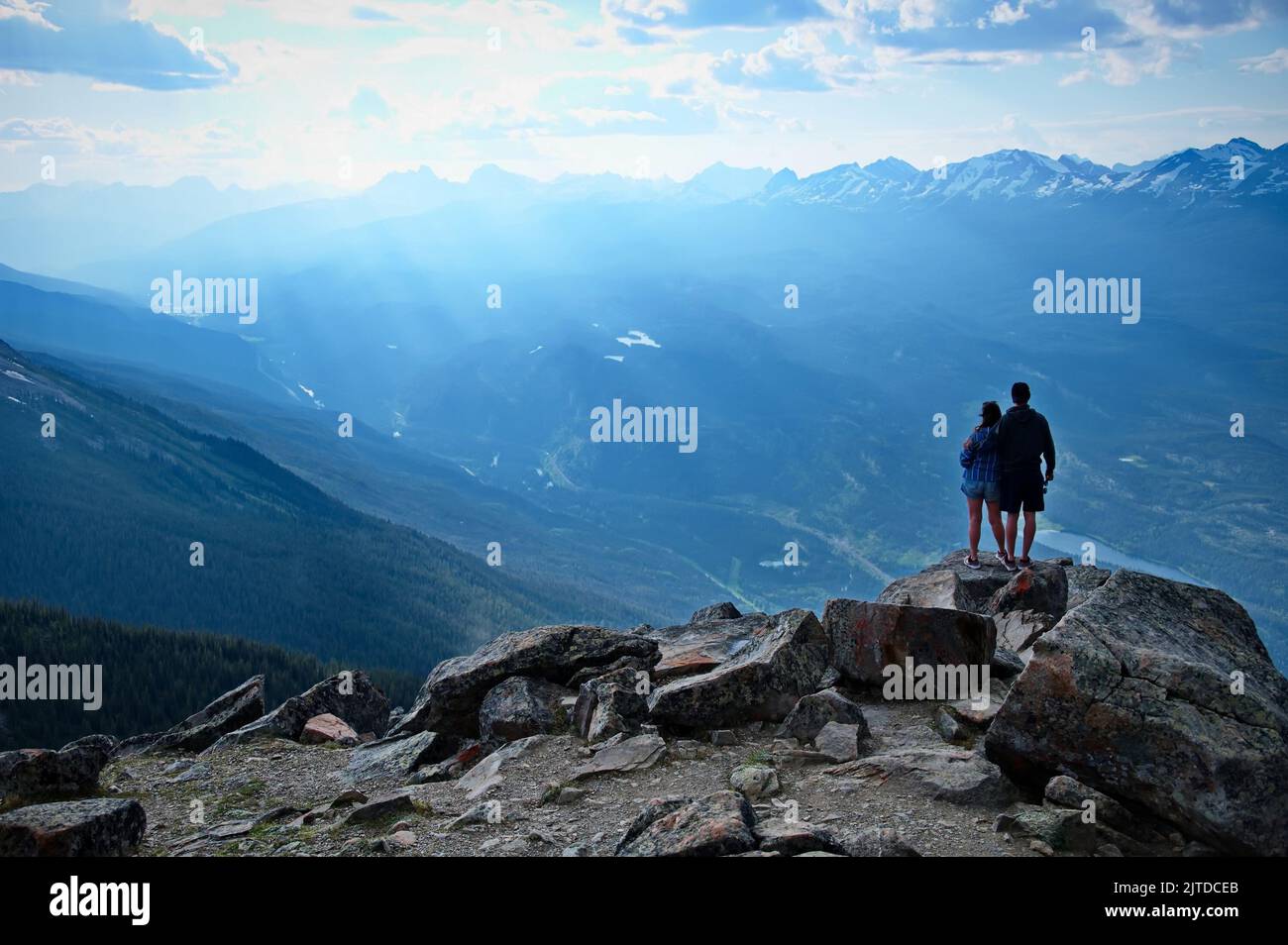 Mature couple standing on the edge of the cliff Stock Photo