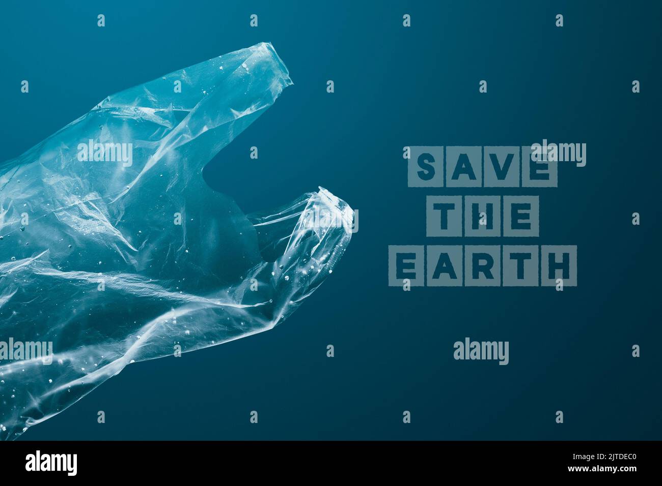 Save the ocean campaign plastic bag sinking in ocean remix media Stock Photo