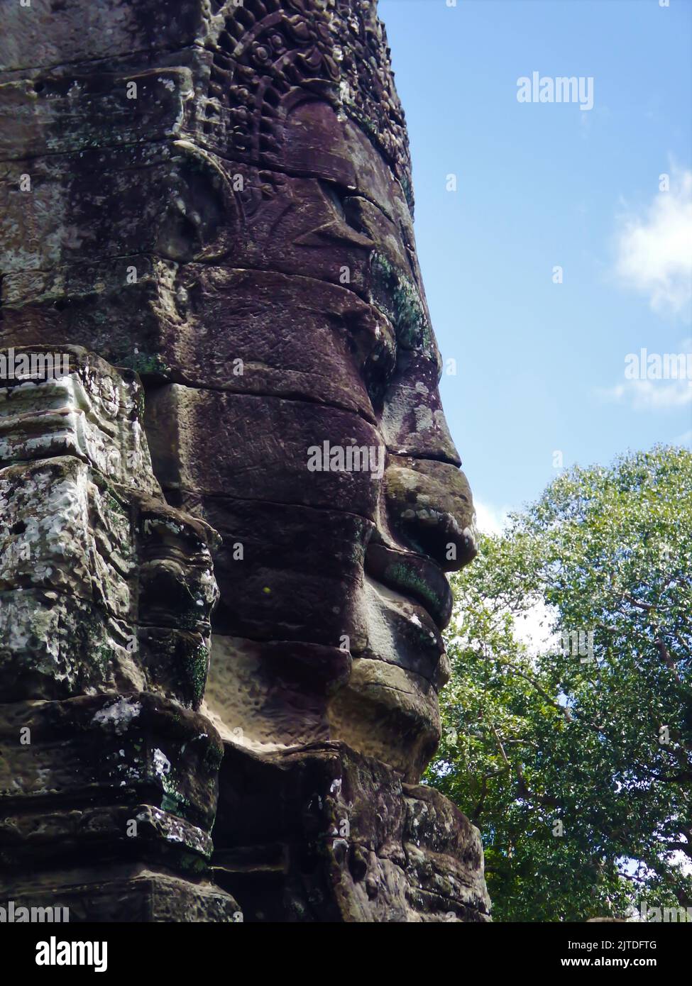 Giant stone faces at Cambodian temple complex Stock Photo - Alamy