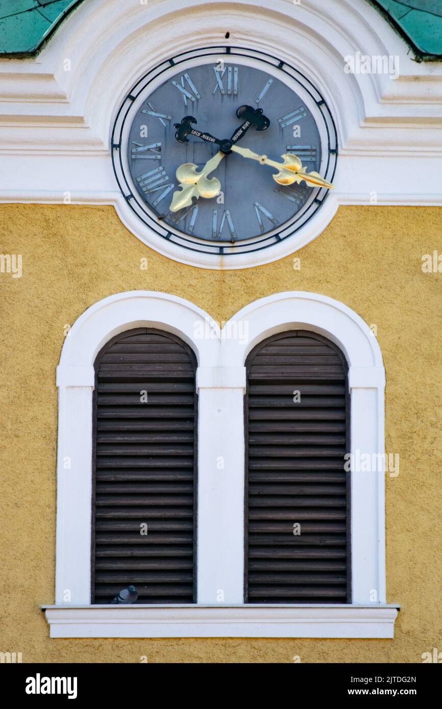 Clock in ornate building facade Stock Photo