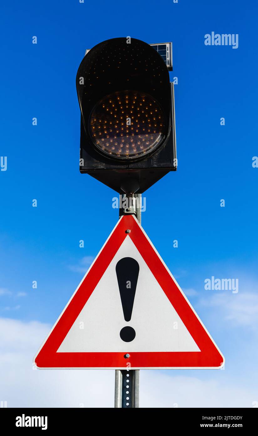Yellow traffic lights and an exclamation mark, triangular sign means