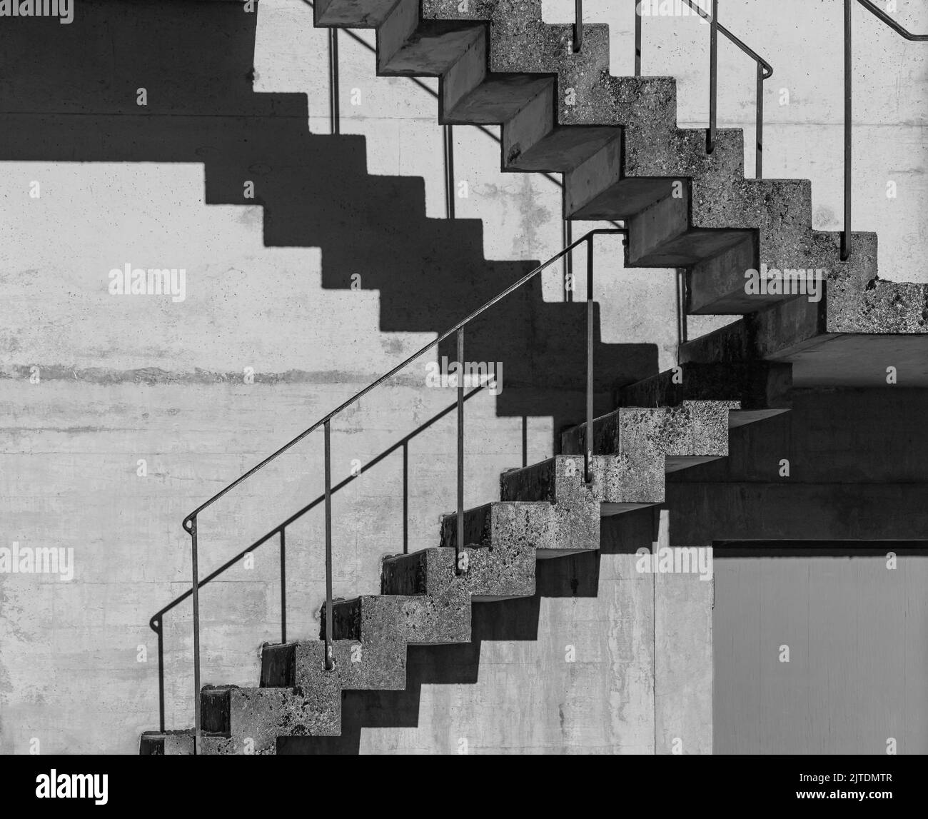 Abstract architecture background, square concrete stairway perspective, stairwell, black and white photo. Minimalism architecture. Modern architecture Stock Photo