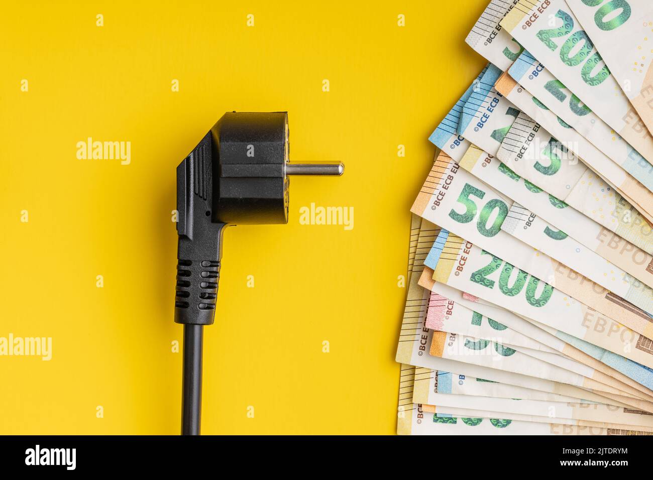 Electric plug and euro money. Concept of the increasing electricity