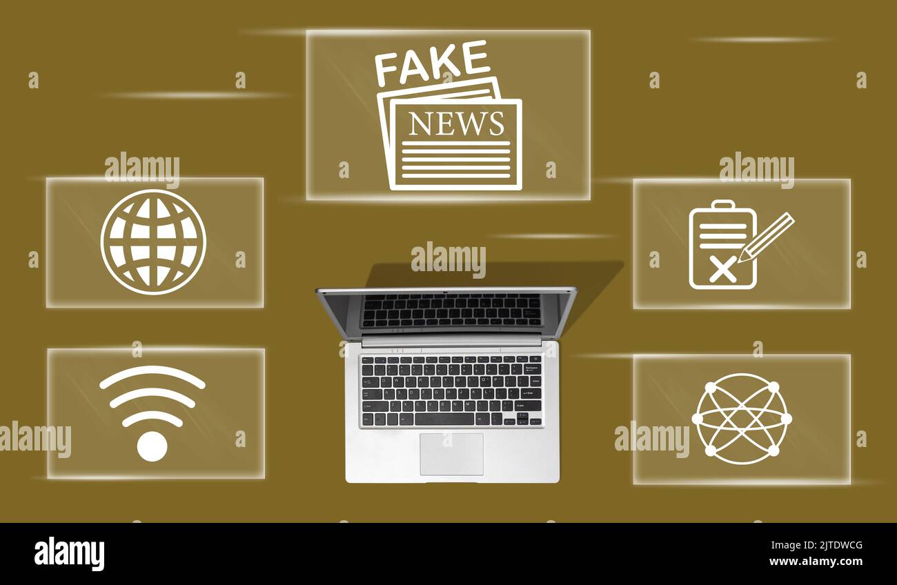 Top view of laptop with symbol of fake news concept Stock Photo - Alamy
