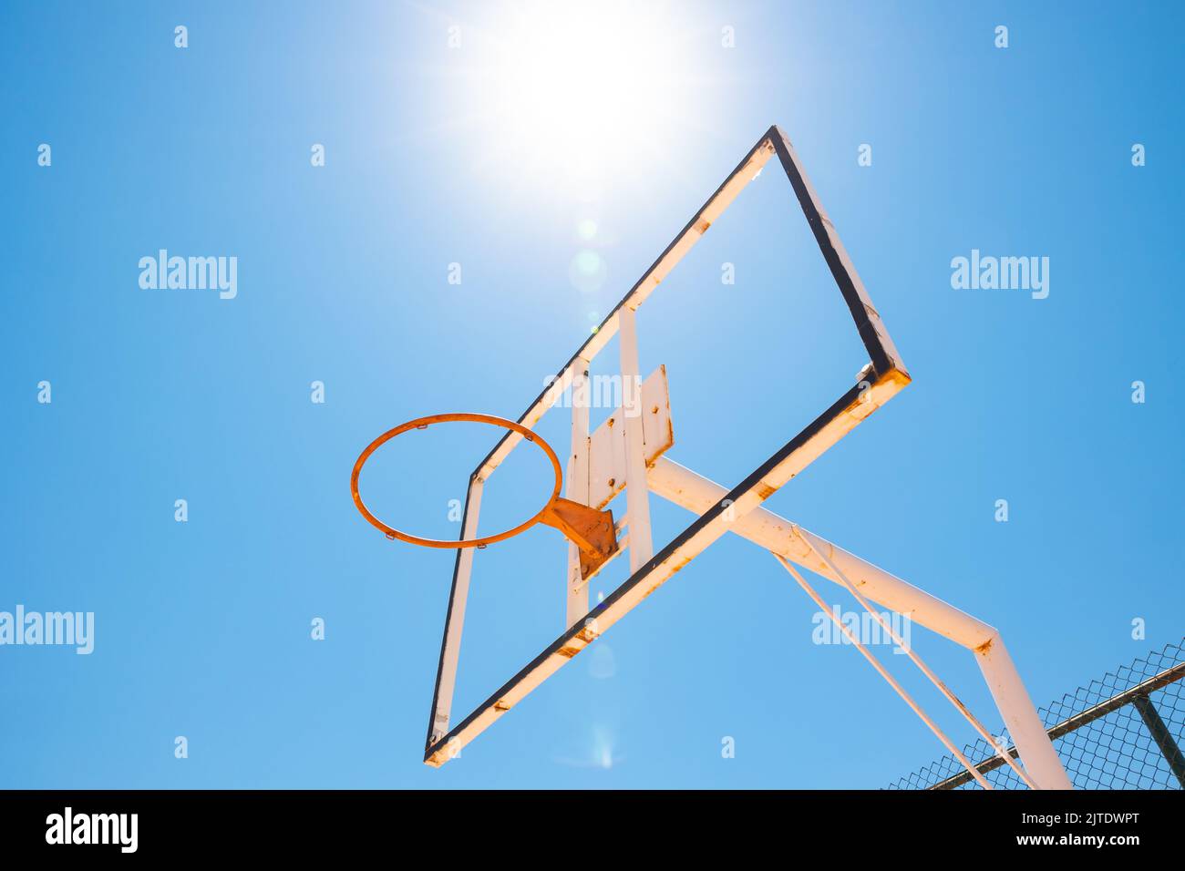 Broken backboard of basketball court in the park. Vandalism concept