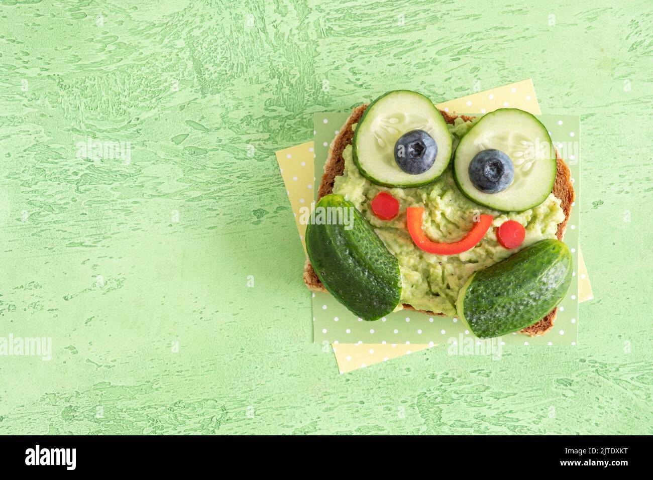 Funny Frog Toast With Cucumber And Mashed Avocado Stock Photo