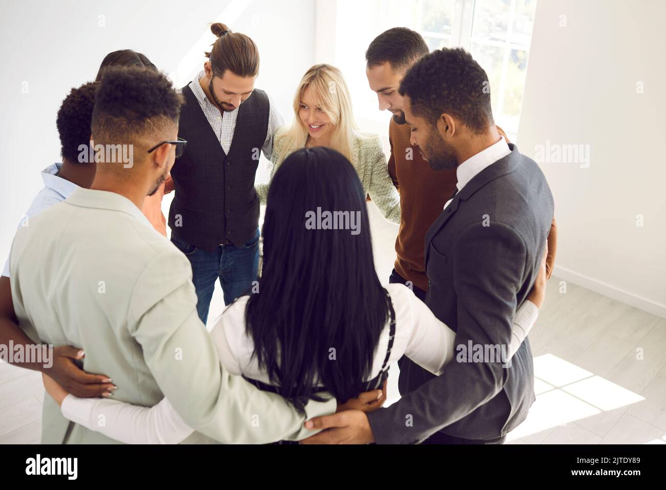 Diverse people in circle engaged in group training Stock Photo