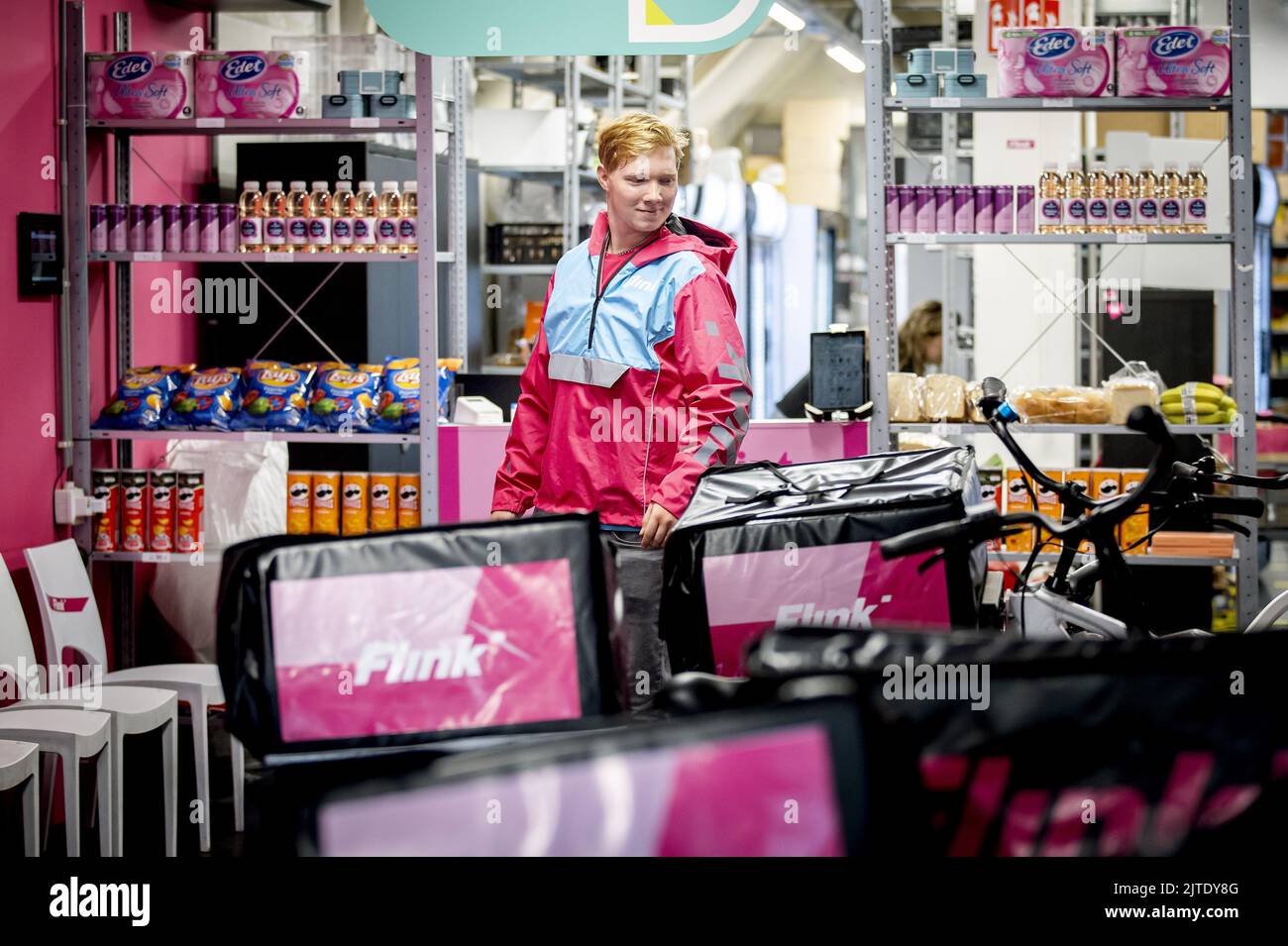 2022-08-26 10:28:07 AMSTERDAM - A rider in a branch of Flitsbezorger ...