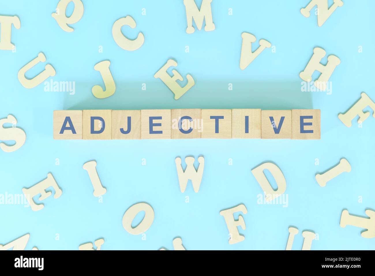 Adjective concept in English grammar and learning class lesson. Wooden