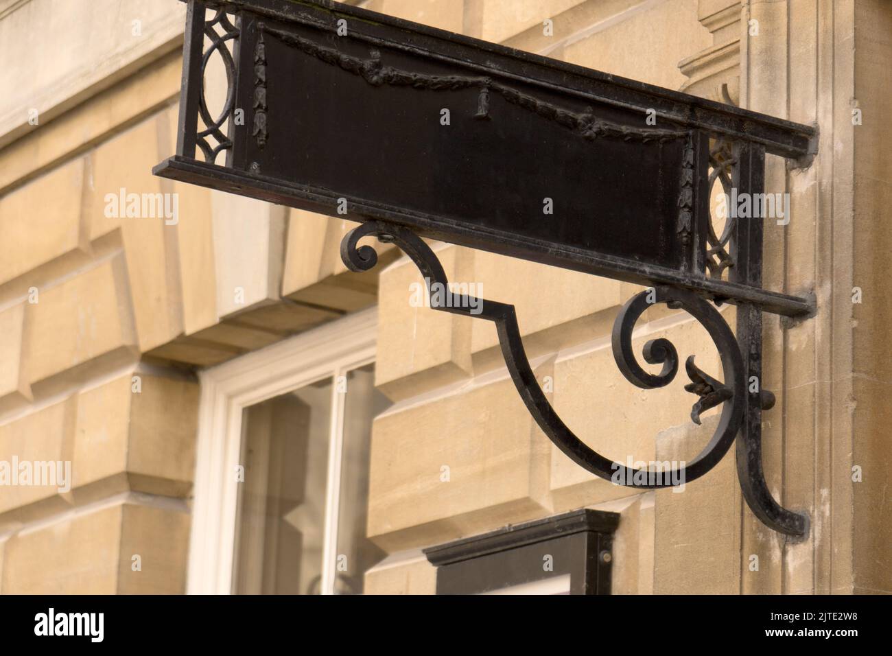 Close-up of black metal empty sign plate board with copy space mounted ...