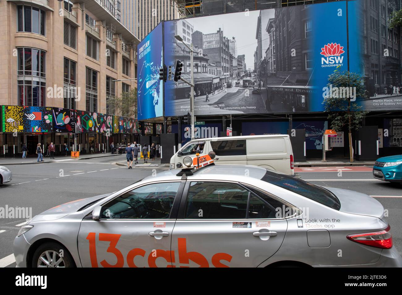 Sydney taxi saloon hire car on Park street in city centre passing