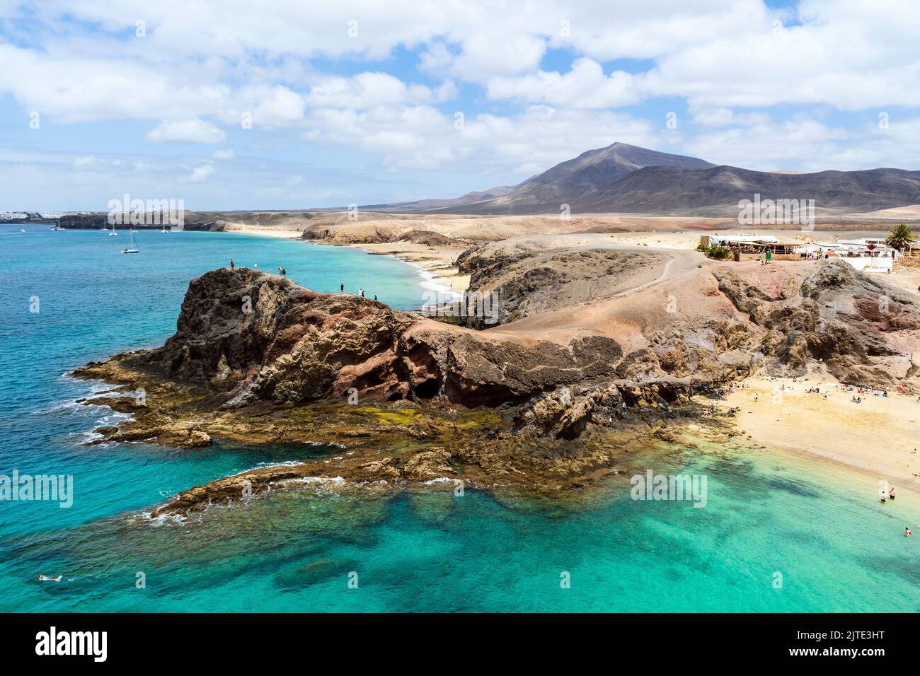 White sand and volcanic rocks at Papagayo Beach located on south end of Lanzarote, Canary Islands, Spain Stock Photo