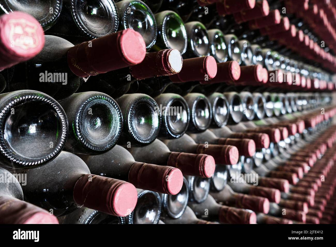 Many bottles in a row stacked on a winery shelf, Lanzarote, Spain Stock Photo
