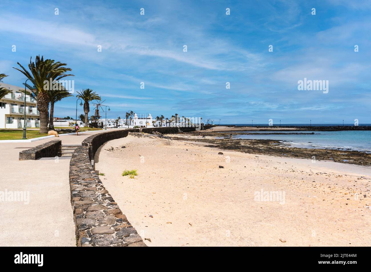 Los Charcos beach with white sand and volcanic rocks in Costa Teguise in Lanzarote, Canary Island, Spain Stock Photo