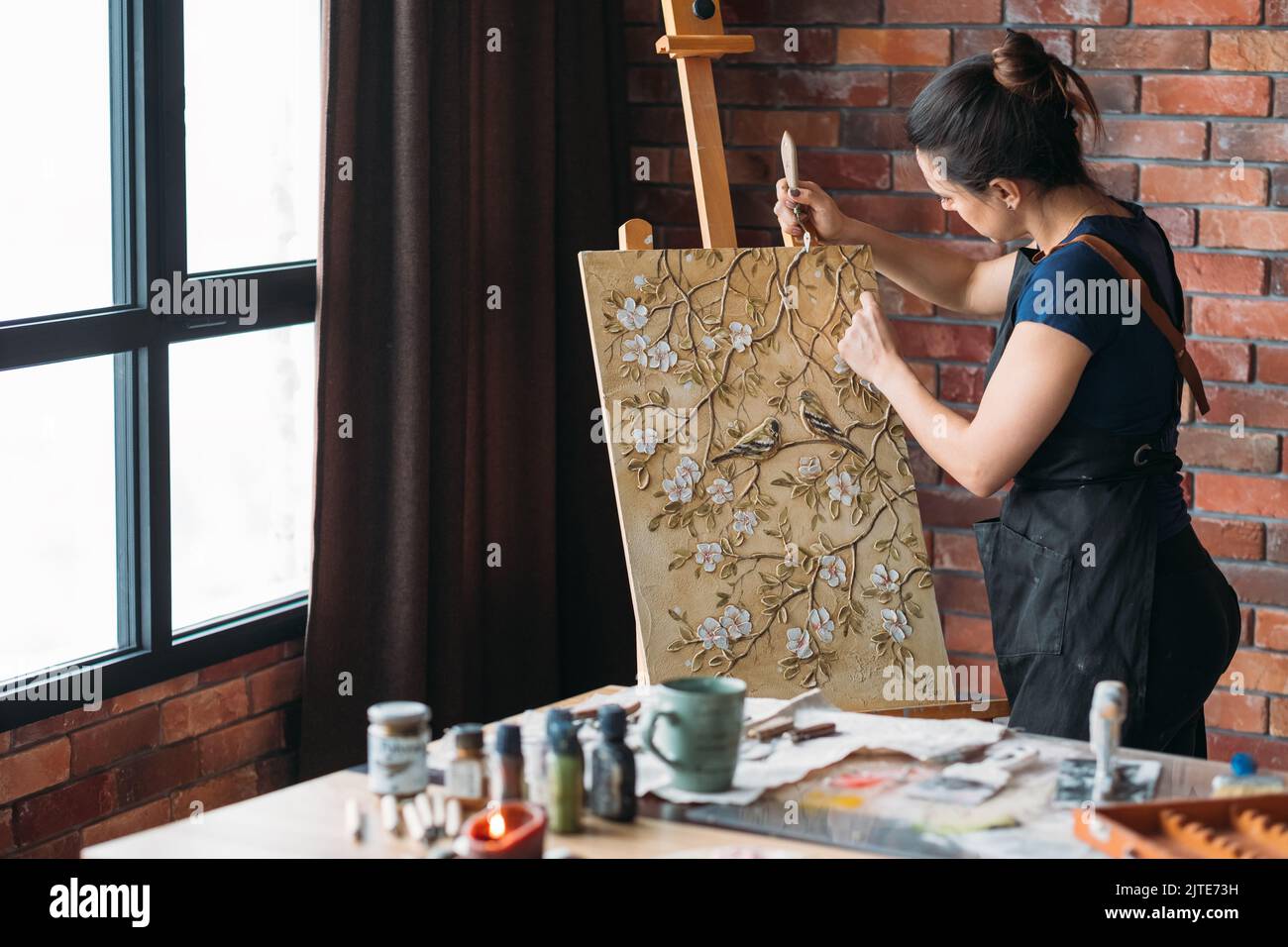 artist work studio woman painter canvas easel Stock Photo