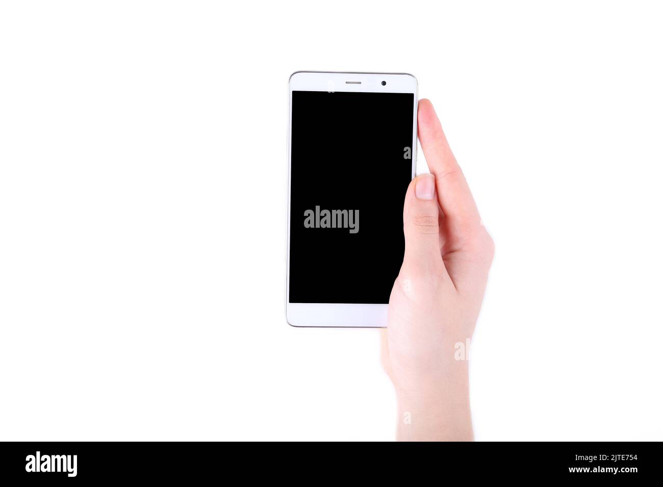 Female hands holding mobile phone with blank screen isolated on white ...