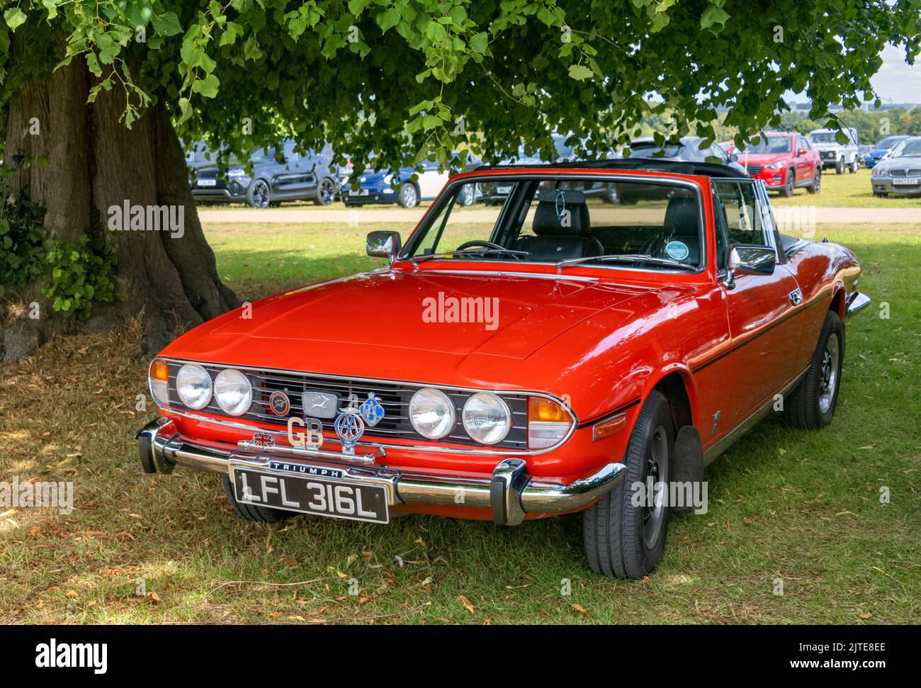 Red Triumph Stag Convertible classic car at Knebworth House classic car show 2022 Stock Photo
