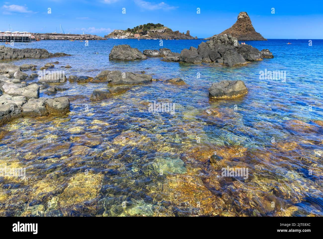 Cyclopean Isles, Aci Trezza, Sicily, Italy. These were the great stones thrown at Odysseus by the monster Cyclops in the epic poem 'The Odyssey.' Stock Photo