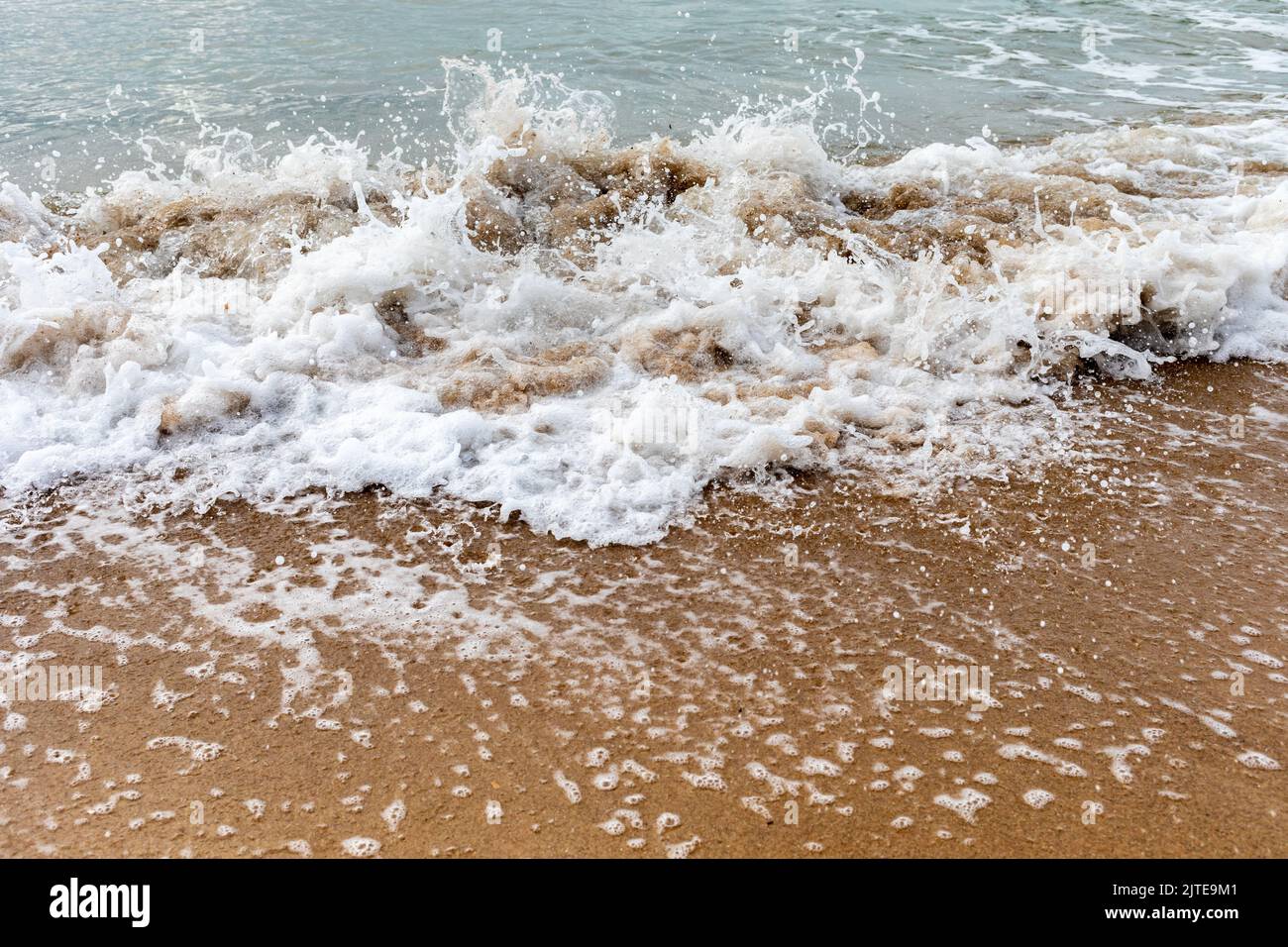 Waves crashing onto the seashore at Bournemouth beach Stock Photo