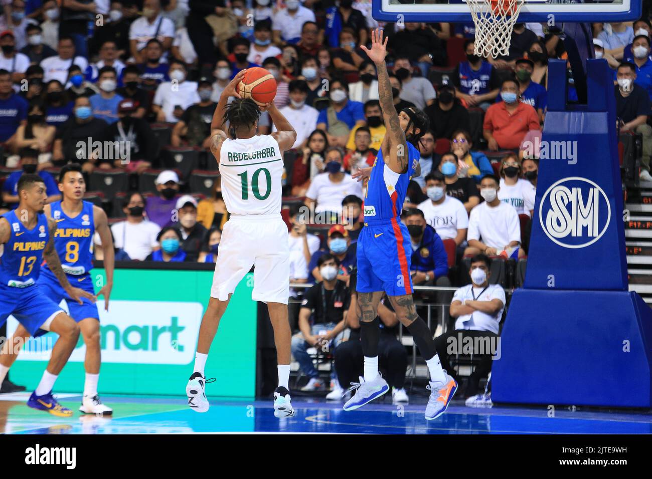 Pasay City, Philippines. 29th Aug, 2022. Khalid M Abdel Gabar (White, 10) tries to shoot over Jordan Clarkson (6, Blue) during the basketball game between the Philippines and Saudi Arabia. (Photo by Dennis Jerome Acosta/Pacific Press) Credit: Pacific Press Media Production Corp./Alamy Live News Stock Photo