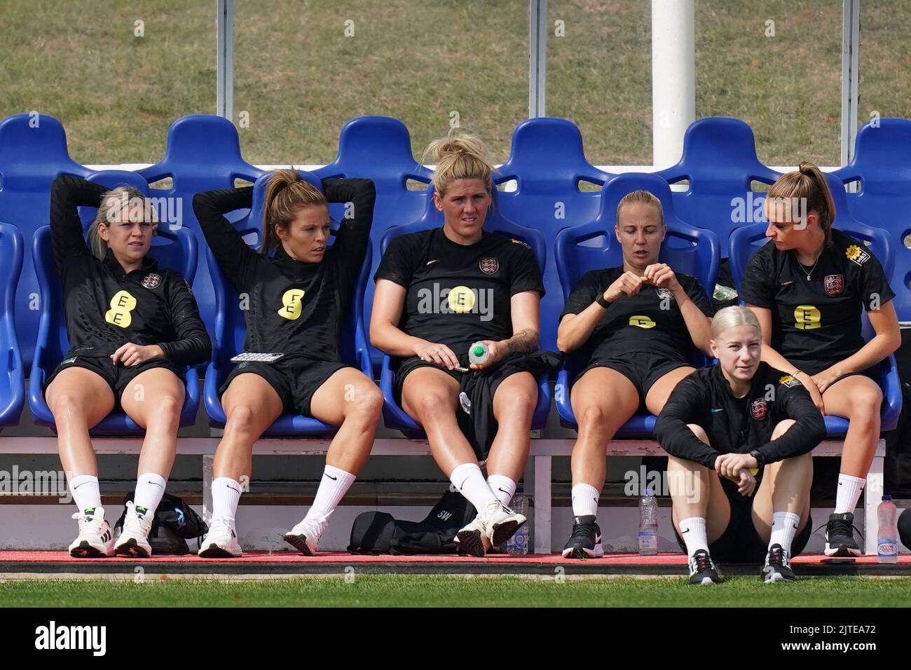 England's Alessia Russo, Rachel Daly, Millie Bright, Beth Mead, Bethany England and Ella Toone in the dugouts during a training session at St. George's Park, Burton-on-Trent. Picture date: Tuesday August 30, 2022. Stock Photo