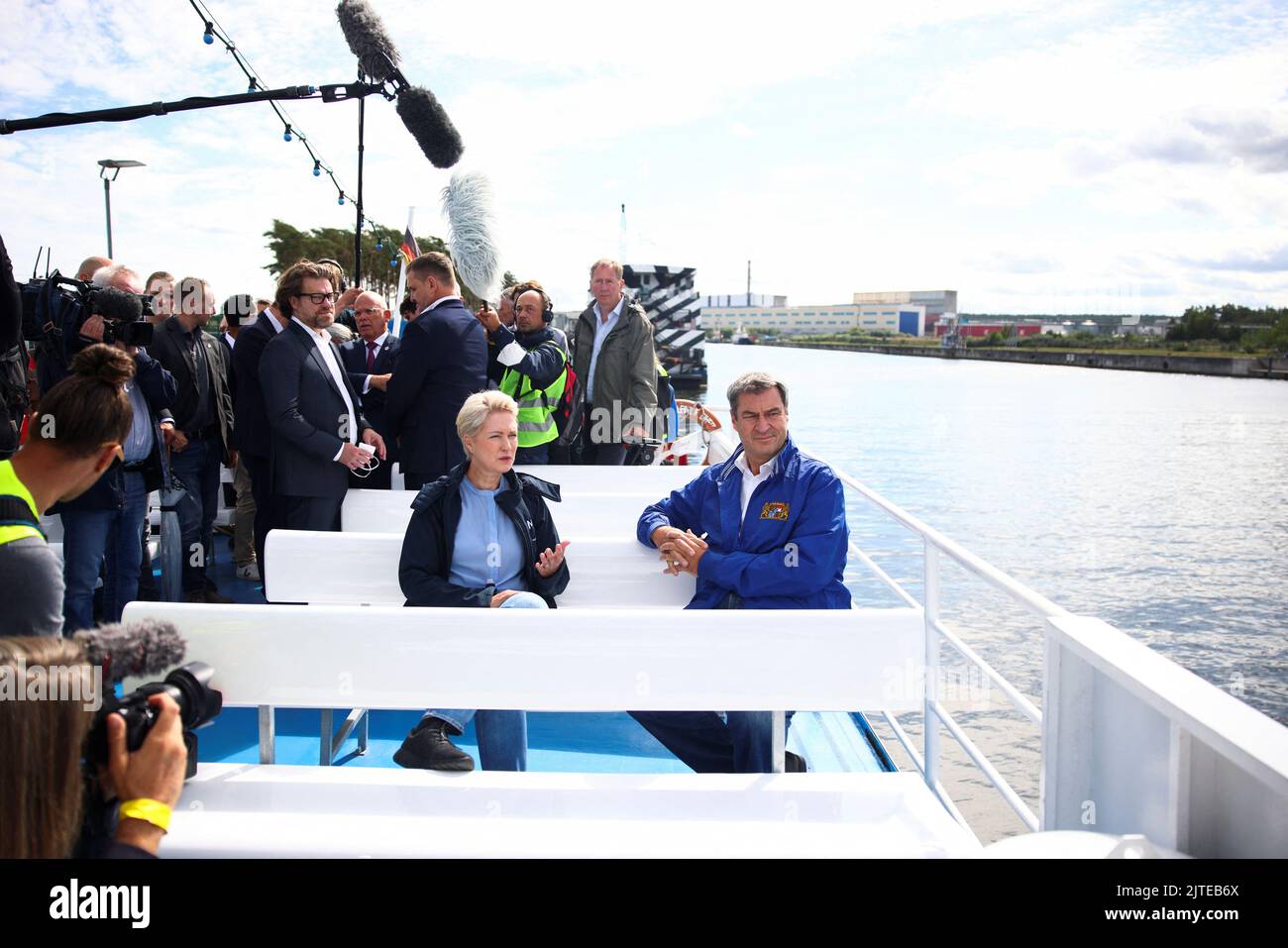Mecklenburg-Western Pomerania state premier Manuela Schwesig and Bavaria's State Premier Markus Soeder travel on a boat as they visit the industrial harbour and the site of a planned liquid gas LNG terminal near Lubmin, Germany, August 30, 2022. REUTERS/Lisi Niesner Stock Photo